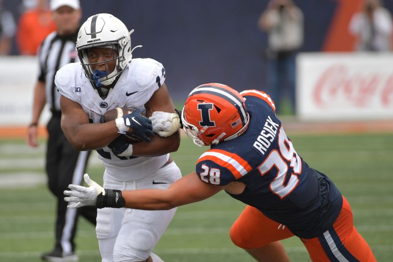 Sep 16, 2023; Champaign, Illinois, USA;  Penn State Nittany Lions running back Kaytron Allen (13) is tackled by Illinois Fighting Illini linebacker Dylan Rosiek (28) during the second half at Memorial Stadium. Mandatory Credit: Ron Johnson-USA TODAY Sports