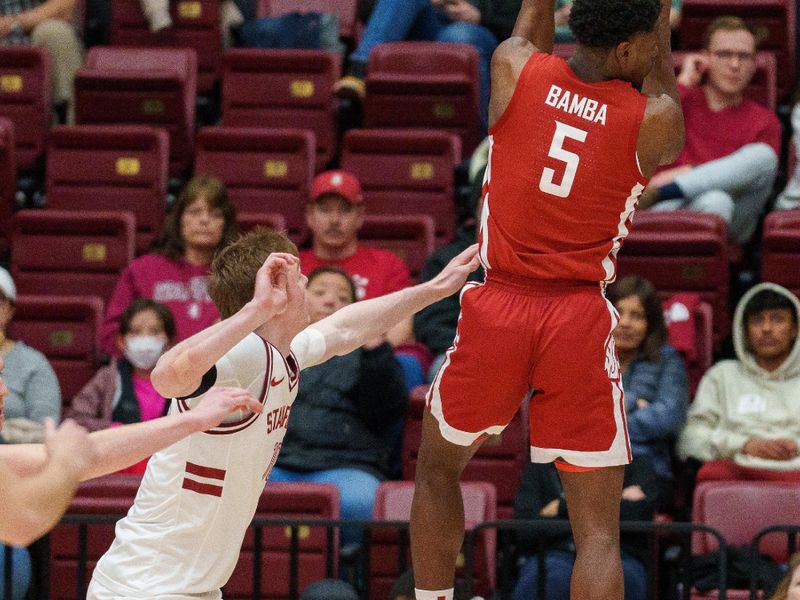 Feb 23, 2023; Stanford, California, USA;  Washington State Cougars guard TJ Bamba (5) grabs the rebound against Stanford Cardinal guard Michael Jones (13) during the second half at Maples Pavilion. Mandatory Credit: Neville E. Guard-USA TODAY Sports