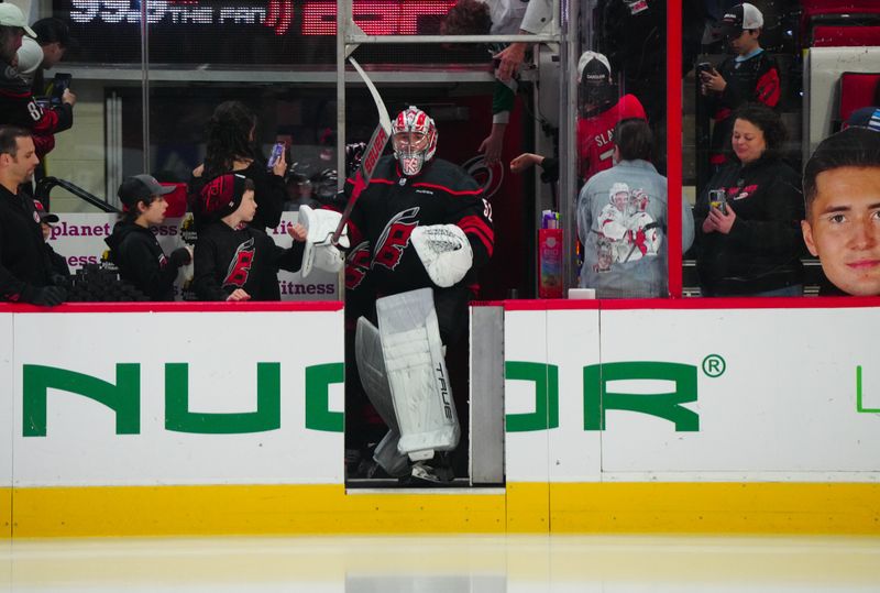 Mar 12, 2024; Raleigh, North Carolina, USA; Carolina Hurricanes goaltender Pyotr Kochetkov (52) comes out onto the ice for the warmups against the New York Rangers at PNC Arena. Mandatory Credit: James Guillory-USA TODAY Sports