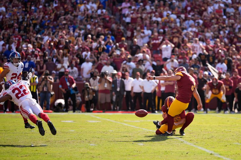 Washington Commanders place kicker Austin Seibert (3) kicks the game-winning field goal against the New York Giants as time expires during the second half of an NFL football game in Landover, Md., Sunday, Sept. 15, 2024. (AP Photo/Matt Slocum)