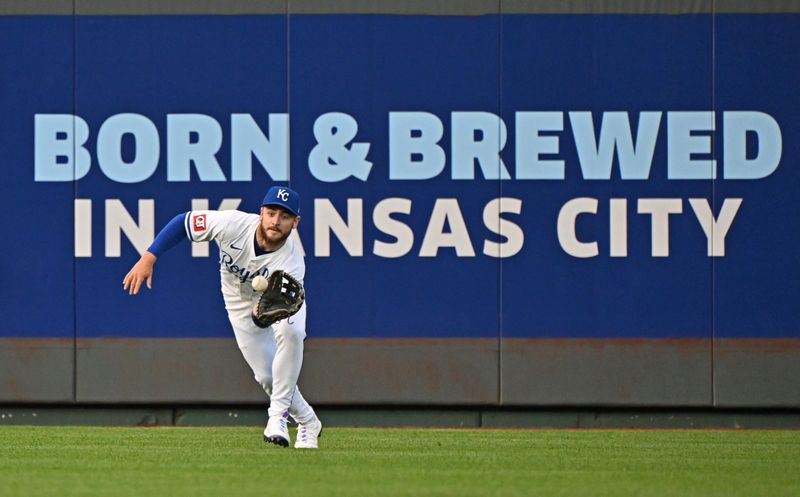 May 21, 2024; Kansas City, Missouri, USA;  Kansas City Royals center fielder Kyle Isbel (28) catches a fly ball in the third inning against the Detroit Tigers at Kauffman Stadium. Mandatory Credit: Peter Aiken-USA TODAY Sports