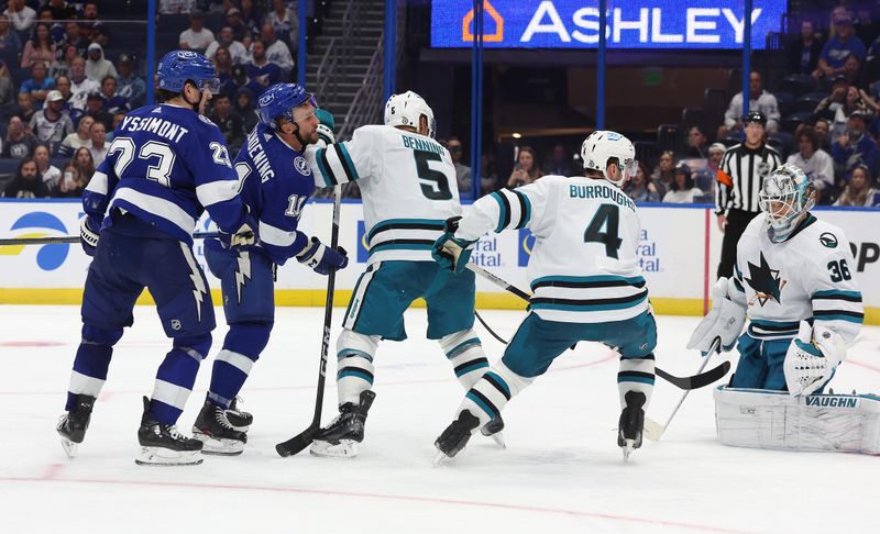 Oct 26, 2023; Tampa, Florida, USA; Tampa Bay Lightning center Luke Glendening (11) scores a goal on San Jose Sharks goaltender Kaapo Kahkonen (36) during the third period at Amalie Arena. Mandatory Credit: Kim Klement Neitzel-USA TODAY Sports