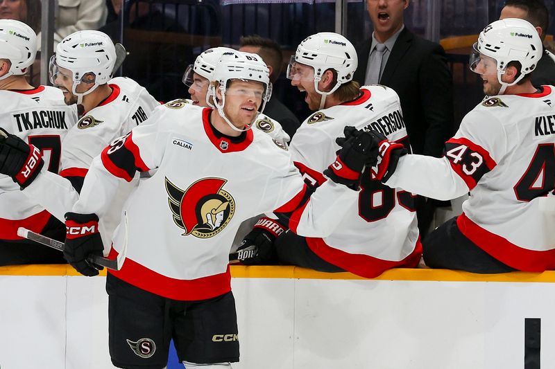 Jan 22, 2026; Nashville, Tennessee, USA; Ottawa Senators center Stephen Halliday (83) celebrates with teammates after scoring a goal against the Nashville Predators during the first period at Bridgestone Arena. Mandatory Credit: Steve Roberts-Imagn Images