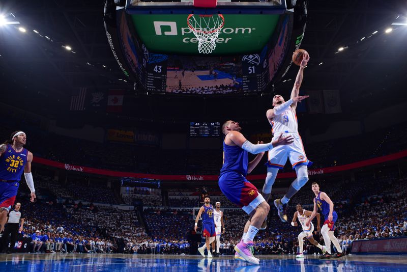OKLAHOMA CITY, OK - MAY 13:  Alex Caruso #9 of the Oklahoma City Thunder drives to the basket during the game against the Denver Nuggets  during Round 2 Game 5 of the 2025 NBA Playoffs on May 13, 2025 at Paycom Center in Oklahoma City, Oklahoma. NOTE TO USER: User expressly acknowledges and agrees that, by downloading and or using this photograph, User is consenting to the terms and conditions of the Getty Images License Agreement. Mandatory Copyright Notice: Copyright 2025 NBAE (Photo by Garrett Ellwood/NBAE via Getty Images)