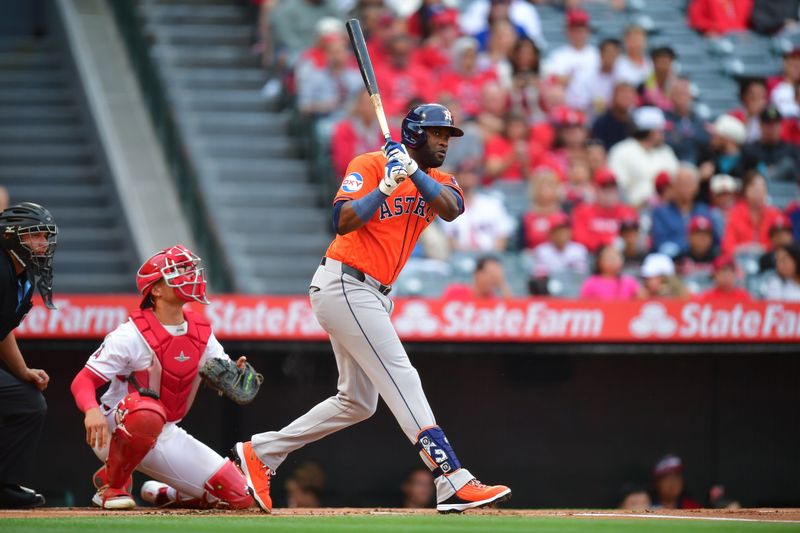 Jun 7, 2024; Anaheim, California, USA; Houston Astros outfielder Yordan Alvarez (44) hits a single against the Los Angeles Angels during the first inning at Angel Stadium. Mandatory Credit: Gary A. Vasquez-USA TODAY Sports