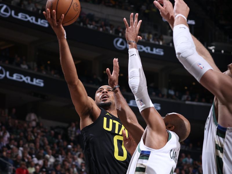 SALT LAKE CITY, UT - MARCH 24: Talen Horton-Tucker #0 of the Utah Jazz drives to the basket during the game against the Milwaukee Bucks on March 24, 2023 at vivint.SmartHome Arena in Salt Lake City, Utah. NOTE TO USER: User expressly acknowledges and agrees that, by downloading and or using this Photograph, User is consenting to the terms and conditions of the Getty Images License Agreement. Mandatory Copyright Notice: Copyright 2023 NBAE (Photo by Melissa Majchrzak/NBAE via Getty Images)