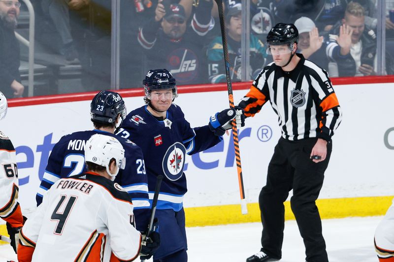 Mar 15, 2024; Winnipeg, Manitoba, CAN; Winnipeg Jets forward Tyler T0ffoli (73) is congratulated by Winnipeg Jets forward Sean Monahan (23) on his goal against the Anaheim Ducks during the third period at Canada Life Centre. Mandatory Credit: Terrence Lee-USA TODAY Sports