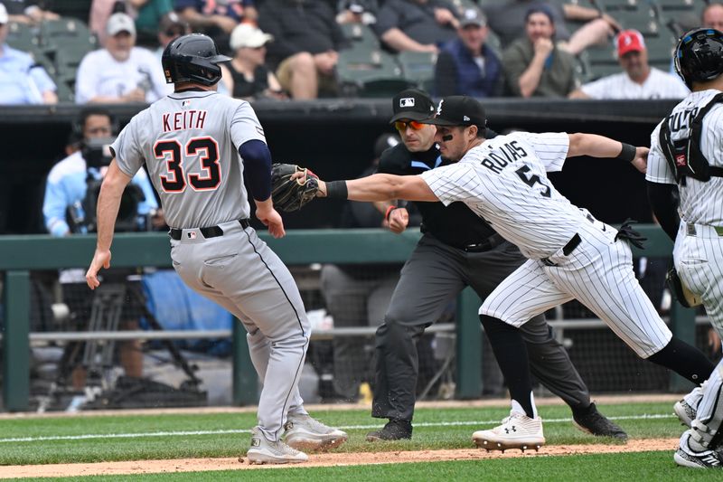 Jun 5, 2025; Chicago, Illinois, USA;  Chicago White Sox third base Josh Rojas (5) tries to tag Detroit Tigers second base Colt Keith (33) out during the seventh inning  at Rate Field. Mandatory Credit: Matt Marton-Imagn Images