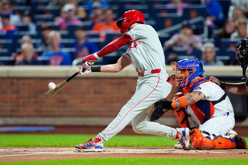 Sep 22, 2024; New York City, New York, USA;  Philadelphia Phillies shortstop Trea Turner (7) hits a single against the New York Mets during the first inning at Citi Field. Mandatory Credit: Gregory Fisher-Imagn Images