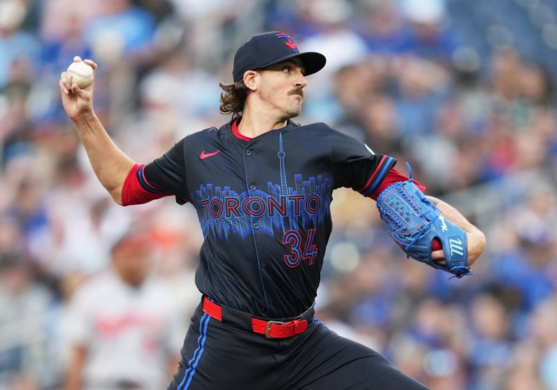 Jun 3, 2024; Toronto, Ontario, CAN; Toronto Blue Jays starting pitcher Kevin Gausman (34) throws a pitch against the Baltimore Orioles during the first inning at Rogers Centre. Mandatory Credit: Nick Turchiaro-USA TODAY Sports