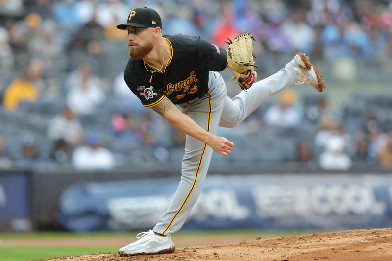 Sep 28, 2024; Bronx, New York, USA; Pittsburgh Pirates relief pitcher Mike Burrows (53) follows through on a pitch against the New York Yankees during the fourth inning at Yankee Stadium. Mandatory Credit: Brad Penner-Imagn Images