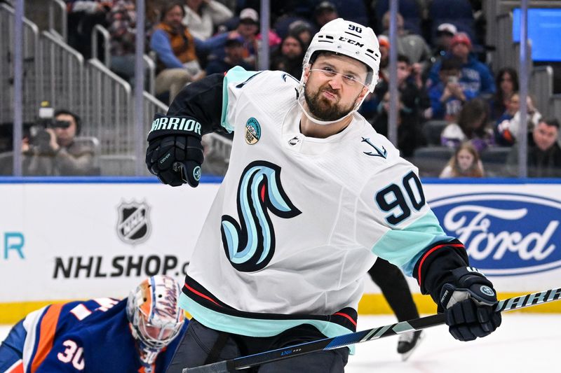 Feb 13, 2024; Elmont, New York, USA; Seattle Kraken left wing Tomas Tatar (90) celebrates his goal against New York Islanders goaltender Ilya Sorokin (30) during shoot outs  at UBS Arena. Mandatory Credit: Dennis Schneidler-USA TODAY Sports