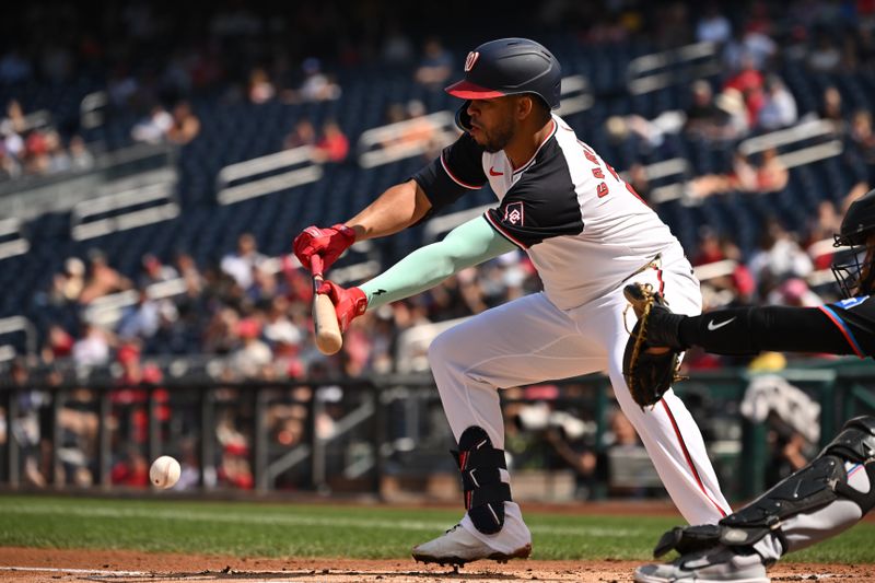 Sep 15, 2024; Washington, District of Columbia, USA; Washington Nationals second baseman Luis Garcia Jr. (2) lays down a bunt against the Miami Marlins during the first inning at Nationals Park. Mandatory Credit: Rafael Suanes-Imagn Images