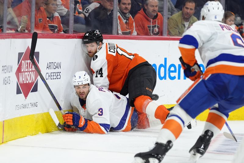 Oct 25, 2025; Philadelphia, Pennsylvania, USA; Philadelphia Flyers center Sean Couturier (14) hits New York Islanders defenseman Adam Pelech (3) in the second period at Xfinity Mobile Arena. Mandatory Credit: Kyle Ross-Imagn Images