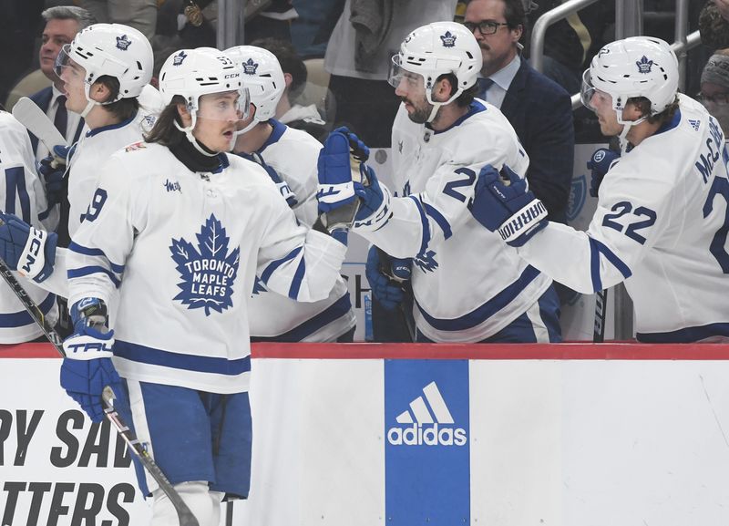 Nov 25, 2023; Pittsburgh, Pennsylvania, USA; Toronto Maple Leafs left wing Tyler Bertuzzi (59) is congratulated after scoring against the Pittsburgh Penguins during the first period at PPG Paints Arena. Mandatory Credit: Philip G. Pavely-USA TODAY Sports