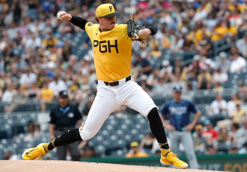 Jun 23, 2024; Pittsburgh, Pennsylvania, USA;  Pittsburgh Pirates starting pitcher Paul Skenes (30) delivers a pitch against the Tampa Bay Rays during the first inning at PNC Park. Mandatory Credit: Charles LeClaire-USA TODAY Sports