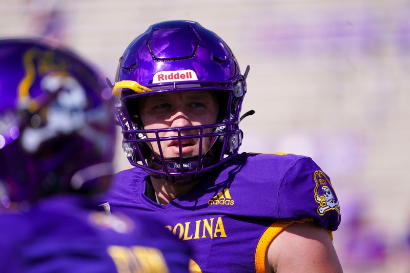 Oct 2, 2021; Greenville, North Carolina, USA;  East Carolina Pirates quarterback Holton Ahlers (12) looks on before the game against the Tulane Green Wave at Dowdy-Ficklen Stadium. Mandatory Credit: James Guillory-USA TODAY Sports