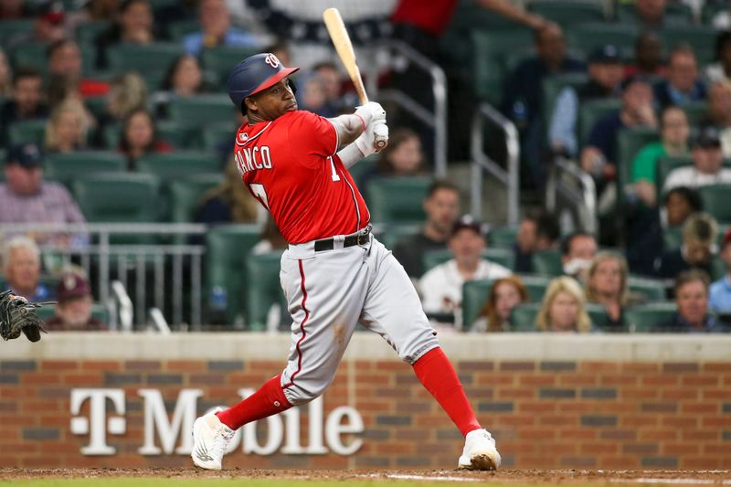 Apr 11, 2022; Atlanta, Georgia, USA; Washington Nationals third baseman Maikel Franco (7) hits a single against the Atlanta Braves in the fifth inning at Truist Park. Mandatory Credit: Brett Davis-USA TODAY Sports