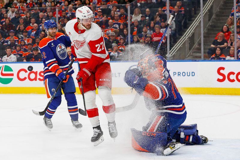 Jan 30, 2025; Edmonton, Alberta, CAN; Detroit Red Wings forward Michael Rasmussen (27) attempts to screen Edmonton Oilers goaltender Stuart Skinner (74) during the second period at Rogers Place. Mandatory Credit: Perry Nelson-Imagn Images