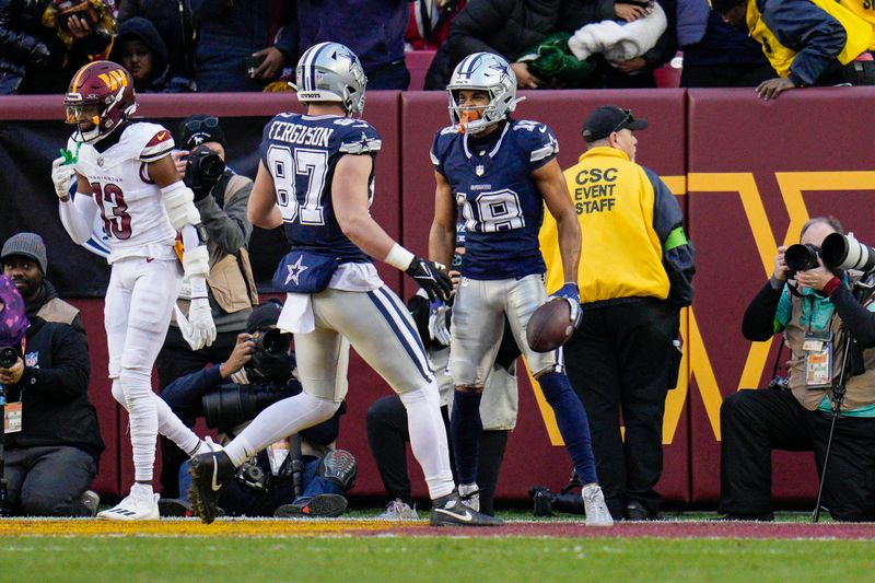 Dallas Cowboys wide receiver Jalen Tolbert (18) celebrates with tight end Jake Ferguson (87) after he catches a touchdown against the Washington Commanders during the first half, Sunday, January 7, 2024, in Landover, Md. Dallas won 38-10. (AP Photo/Jess Rapfogel)