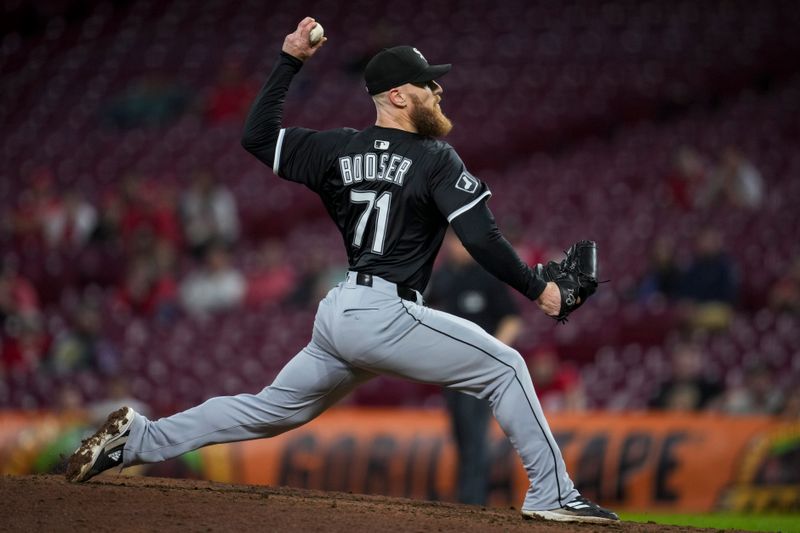 May 13, 2025; Cincinnati, Ohio, USA;  Chicago White Sox pitcher Cam Booser (71) throws against the Cincinnati Reds in the 10th inning at Great American Ball Park. Mandatory Credit: Aaron Doster-Imagn Images
