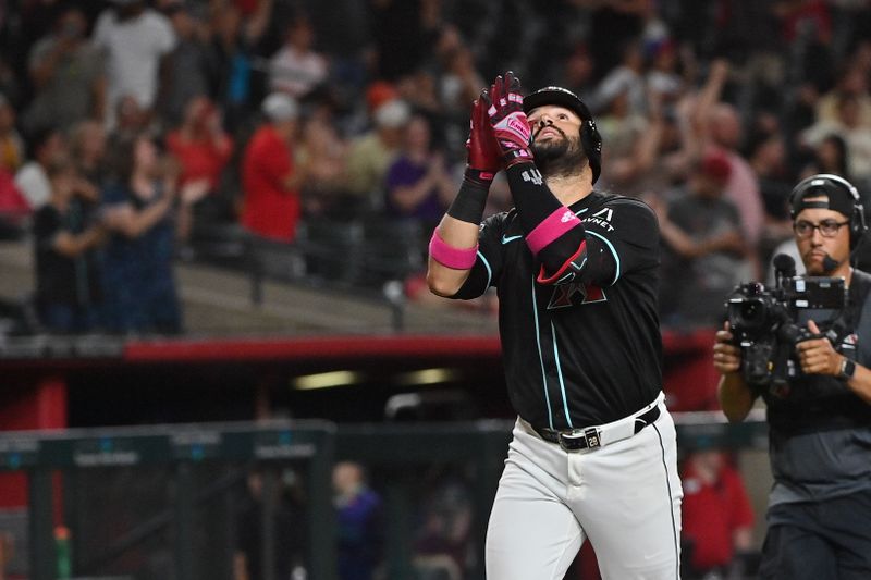 Jun 30, 2025; Phoenix, Arizona, USA;  Arizona Diamondbacks third base Eugenio Suárez (28) hits a solo home run in the eighth inning against the San Francisco Giants at Chase Field. Mandatory Credit: Matt Kartozian-Imagn Images
