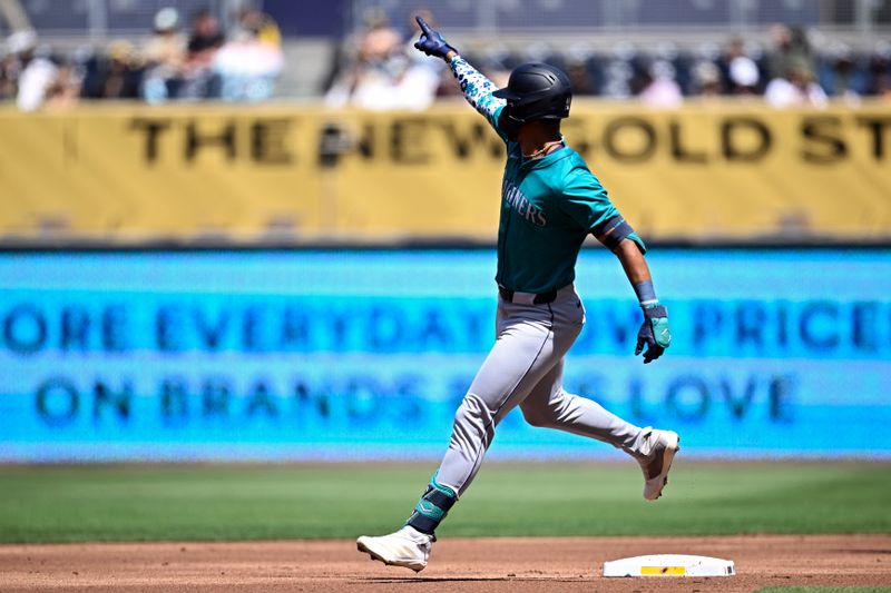 Mar 26, 2024; San Diego, California, USA; Seattle Mariners center fielder Julio Rodriguez (44) rounds the bases after hitting a two-run home run against the San Diego Padres during the first inning at Petco Park. Mandatory Credit: Orlando Ramirez-USA TODAY Sports