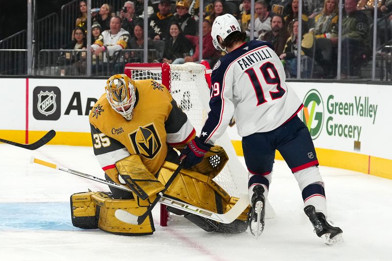 Jan 30, 2025; Las Vegas, Nevada, USA; Vegas Golden Knights goaltender Ilya Samsonov (35) makes a save against Columbus Blue Jackets center Adam Fantilli (19) during the first period at T-Mobile Arena. Mandatory Credit: Stephen R. Sylvanie-Imagn Images