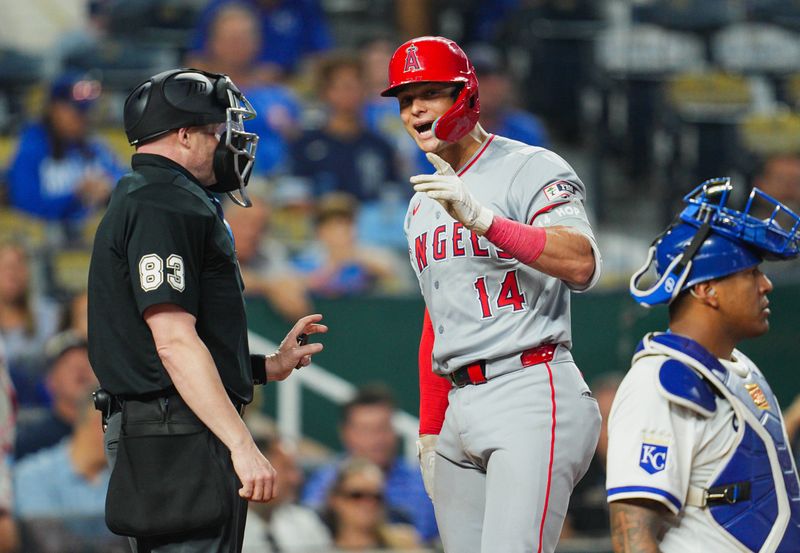 Aug 21, 2024; Kansas City, Missouri, USA; Los Angeles Angels catcher Logan O'Hoppe (14) talks with umpire Mike Estabrook (83) during the ninth inning against the Kansas City Royals at Kauffman Stadium. Mandatory Credit: Jay Biggerstaff-USA TODAY Sports