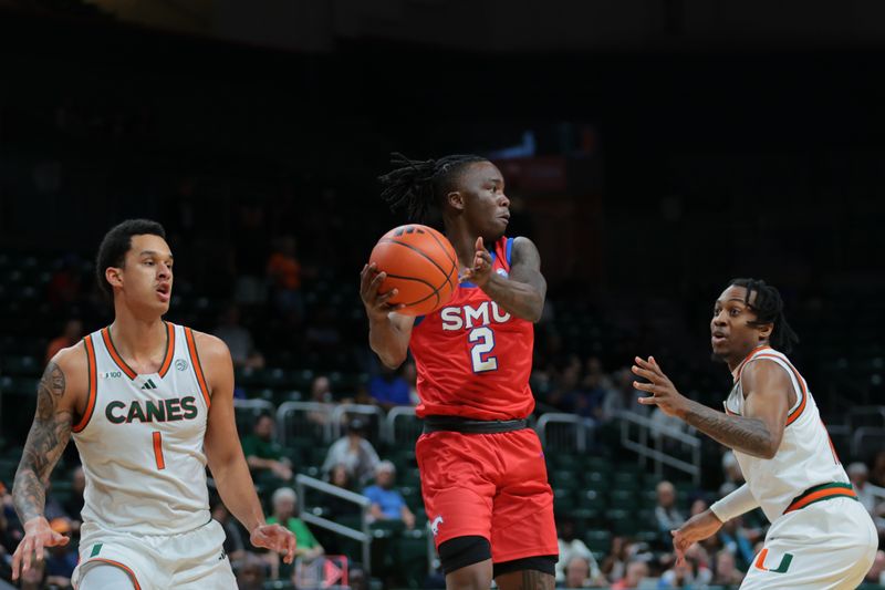 Jan 18, 2025; Coral Gables, Florida, USA; Southern Methodist Mustangs guard Boopie Miller (2) passes the basketball as Miami Hurricanes center Lynn Kidd (1) and guard A.J. Staton-McCray (11) defend during the first half at Watsco Center. Mandatory Credit: Sam Navarro-Imagn Images