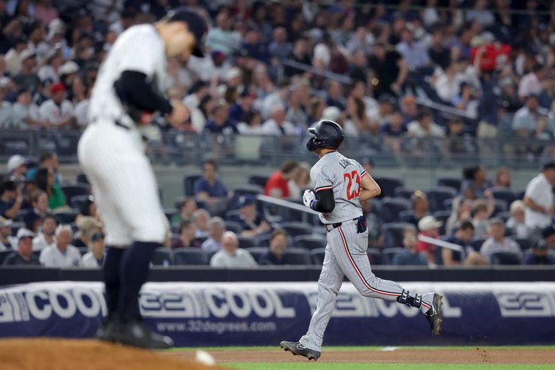 Jun 4, 2024; Bronx, New York, USA; Minnesota Twins third baseman Royce Lewis (23) rounds the bases after hitting a solo home run against New York Yankees relief pitcher Tommy Kahnle (41) during the seventh inning at Yankee Stadium. Mandatory Credit: Brad Penner-USA TODAY Sports