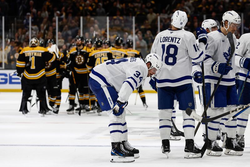 Oct 26, 2024; Boston, Massachusetts, USA; Toronto Maple Leafs center Auston Matthews (34) and teammates head for the dressing room as the Boston Bruins congratulate each other after their 4-3 overtime win at TD Garden. Mandatory Credit: Winslow Townson-Imagn Images