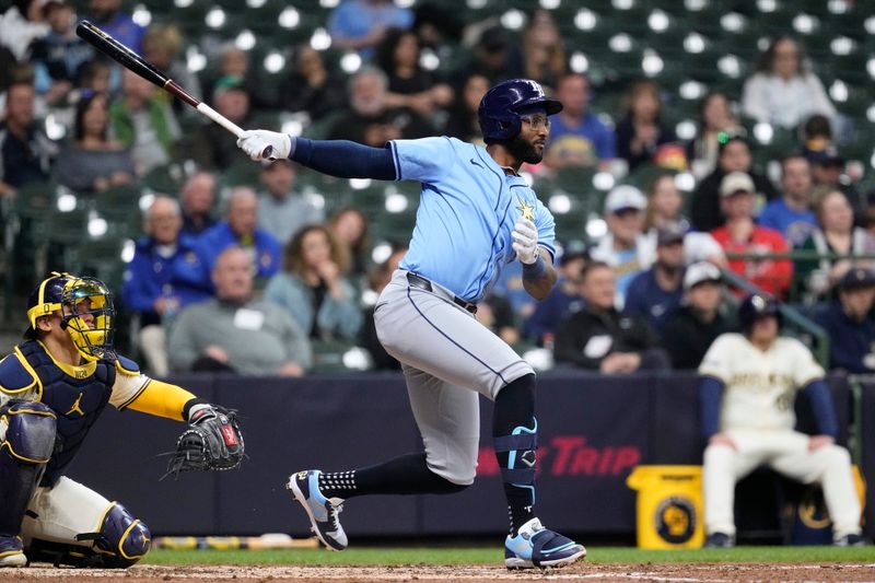 Apr 29, 2024; Milwaukee, Wisconsin, USA;  Tampa Bay Rays second baseman Niko Goodrum (0) singles during the fifth inning against the Milwaukee Brewers at American Family Field. Mandatory Credit: Jeff Hanisch-USA TODAY Sports