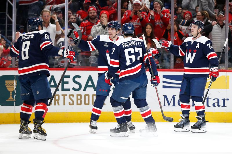 Jan 7, 2024; Washington, District of Columbia, USA; Washington Capitals center Dylan Strome (17) celebrates with teammates after scoring a goal against the Los Angeles Kings during the second period at Capital One Arena. Mandatory Credit: Amber Searls-USA TODAY Sports