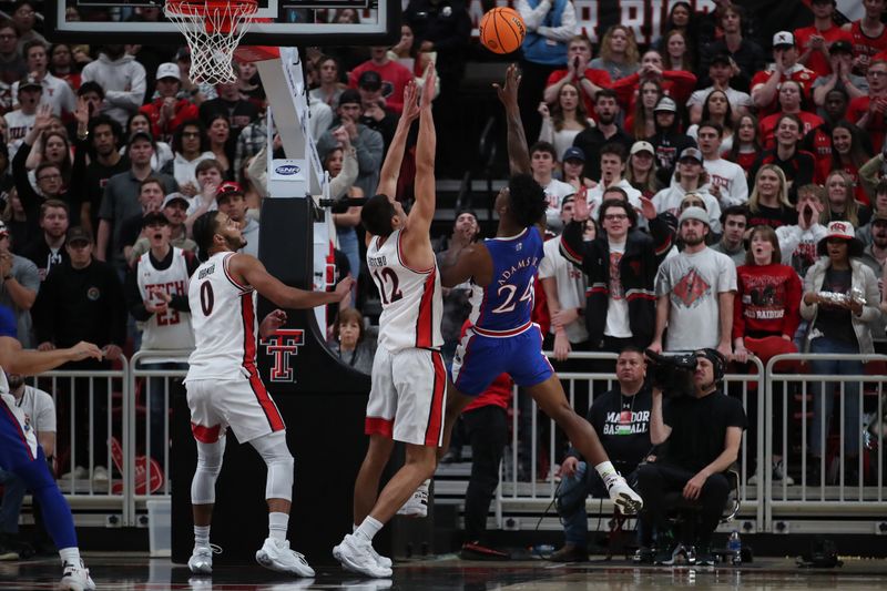 Jan 3, 2023; Lubbock, Texas, USA;  Kansas Jayhawks forward KJ Adams Jr (24) shoots over Texas Tech Red Raiders forward Daniel Batcho (12) in the second half at United Supermarkets Arena. Mandatory Credit: Michael C. Johnson-USA TODAY Sports