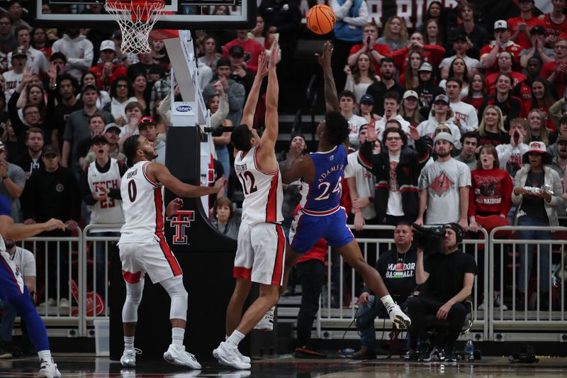 Jan 3, 2023; Lubbock, Texas, USA;  Kansas Jayhawks forward KJ Adams Jr (24) shoots over Texas Tech Red Raiders forward Daniel Batcho (12) in the second half at United Supermarkets Arena. Mandatory Credit: Michael C. Johnson-USA TODAY Sports