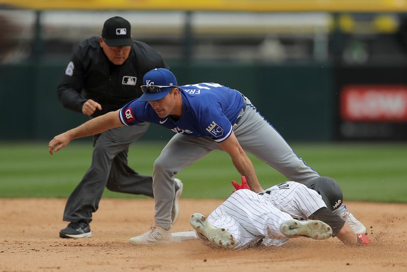 Apr 17, 2024; Chicago, Illinois, USA; Kansas City Royals second base Adam Frazier (26) tags Chicago White Sox outfielder Andrew Benintendi (23) out at second base after trying to steal during the fourth inning during game one of a double header at Guaranteed Rate Field. Mandatory Credit: Melissa Tamez-USA TODAY Sports