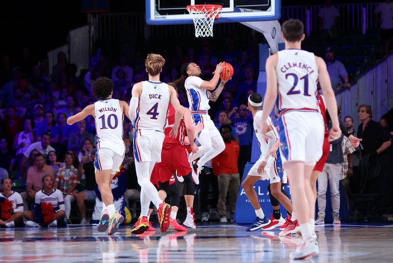 Nov 24, 2022; Paradise Island, BAHAMAS; Kansas Jayhawks guard Bobby Pettiford Jr. (0) hits the game winning shot to beat the Wisconsin Badgers in overtime at Imperial Arena. Mandatory Credit: Kevin Jairaj-USA TODAY Sports