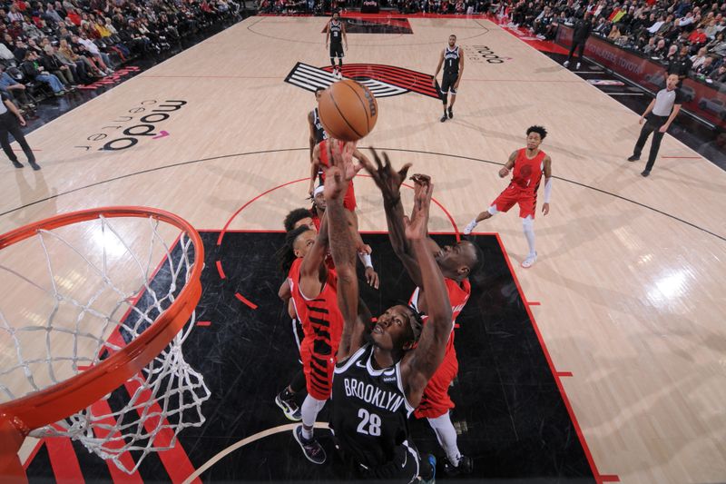 PORTLAND, OR - JANUARY 17: Dorian Finney-Smith #28 of the Brooklyn Nets attempts to rebound the ball during the game against the Portland Trail Blazers on January 17, 2024 at the Moda Center Arena in Portland, Oregon. NOTE TO USER: User expressly acknowledges and agrees that, by downloading and or using this photograph, user is consenting to the terms and conditions of the Getty Images License Agreement. Mandatory Copyright Notice: Copyright 2024 NBAE (Photo by Cameron Browne/NBAE via Getty Images)