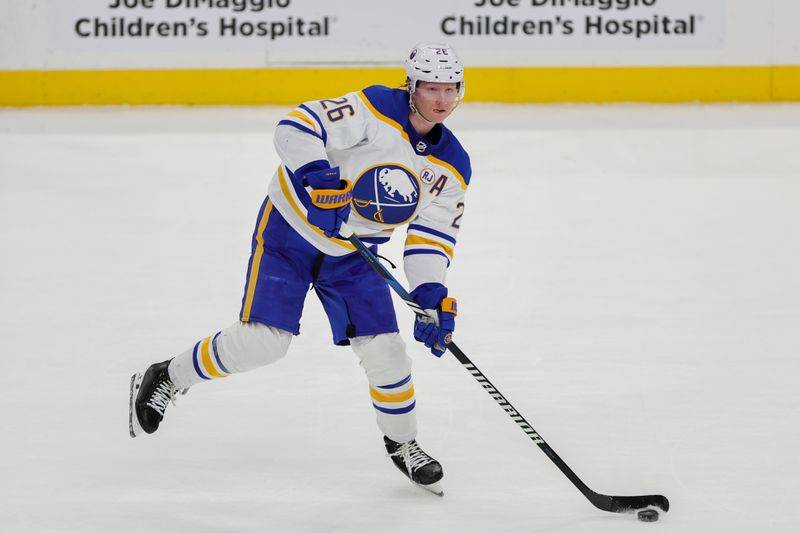 Feb 27, 2024; Sunrise, Florida, USA; Buffalo Sabres defenseman Rasmus Dahlin (26) moves the puck against the Florida Panthers during the first period at Amerant Bank Arena. Mandatory Credit: Sam Navarro-USA TODAY Sports