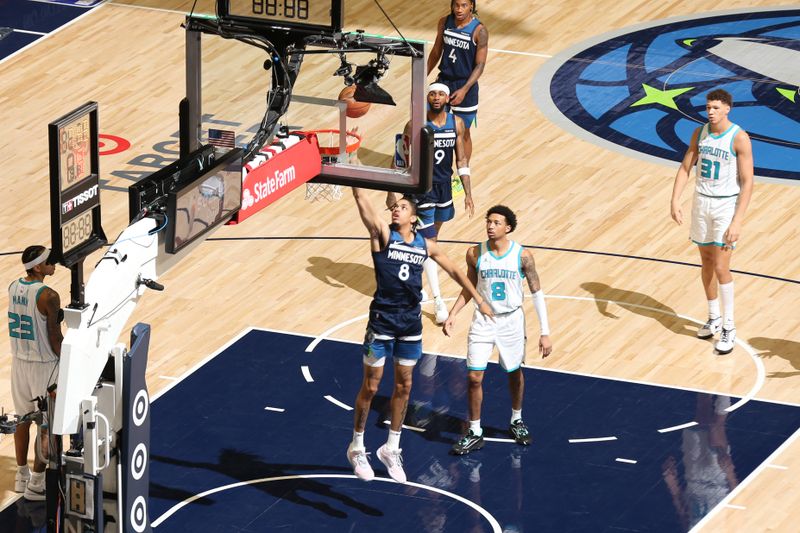 MINNEAPOLIS, MN -  NOVEMBER 4: Josh Minott #8 of the Minnesota Timberwolves drives to the basket during the game against the Charlotte Hornets on November 4, 2024 at Target Center in Minneapolis, Minnesota. NOTE TO USER: User expressly acknowledges and agrees that, by downloading and or using this Photograph, user is consenting to the terms and conditions of the Getty Images License Agreement. Mandatory Copyright Notice: Copyright 2024 NBAE (Photo by David Sherman/NBAE via Getty Images)