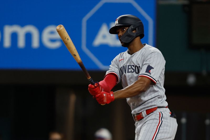 Sep 2, 2023; Arlington, Texas, USA; Minnesota Twins center fielder Michael A. Taylor (2) hits a two run double in the fourth inning against the Texas Rangers at Globe Life Field. Mandatory Credit: Tim Heitman-USA TODAY Sports