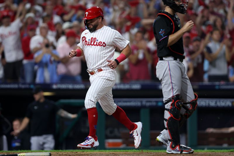 Oct 4, 2023; Philadelphia, Pennsylvania, USA; Philadelphia Phillies left fielder Kyle Schwarber (12) scores a run against the Miami Marlins during the third inning for game two of the Wildcard series for the 2023 MLB playoffs at Citizens Bank Park. Mandatory Credit: Bill Streicher-USA TODAY Sports