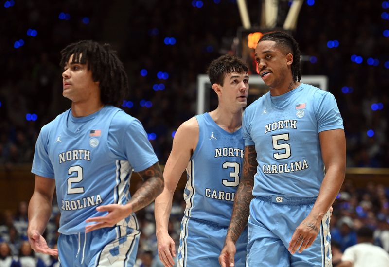 Mar 9, 2024; Durham, North Carolina, USA; North Carolina Tar Heels guard Cormac Ryan (3) talks to forward Armando Bacot (5) during the first half at Cameron Indoor Stadium. Mandatory Credit: Rob Kinnan-USA TODAY Sports