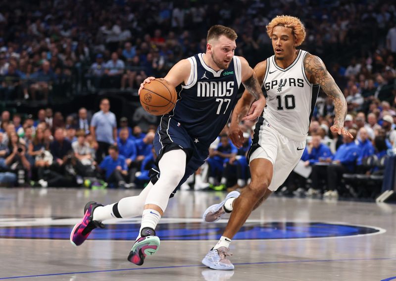 DALLAS, TEXAS - OCTOBER 24: Luka Doncic #77 of the Dallas Mavericks drives against Jeremy Sochan #10 of the San Antonio Spurs during the first quarter of the game at American Airlines Center on October 24, 2024 in Dallas, Texas.  NOTE TO USER: User expressly acknowledges and agrees that, by downloading and or using this photograph, User is consenting to the terms and conditions of the Getty Images License Agreement. (Photo by Sam Hodde/Getty Images)