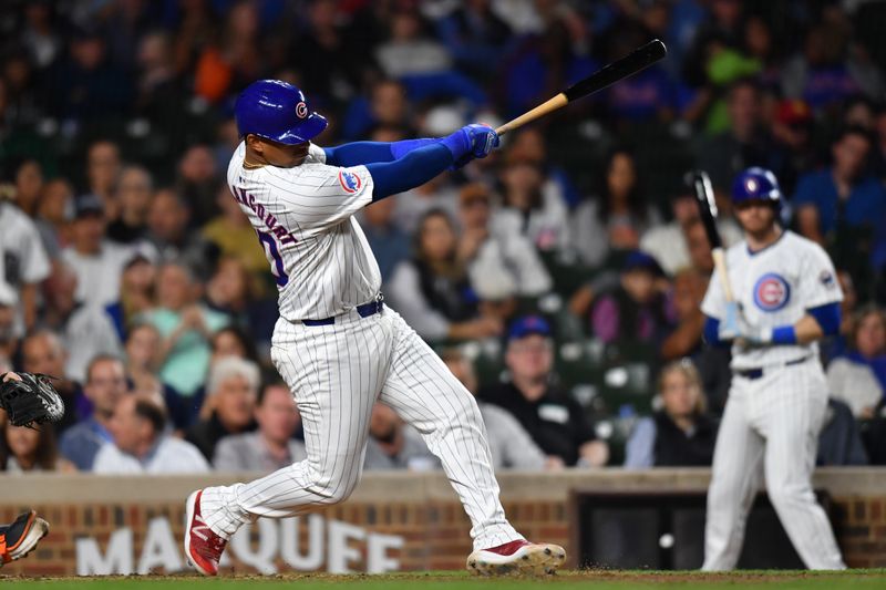 Aug 21, 2024; Chicago, Illinois, USA; Chicago Cubs catcher Christian Bethancourt (60) hits a two-run home run during the fifth inning against the Detroit Tigers at Wrigley Field. Mandatory Credit: Patrick Gorski-USA TODAY Sports