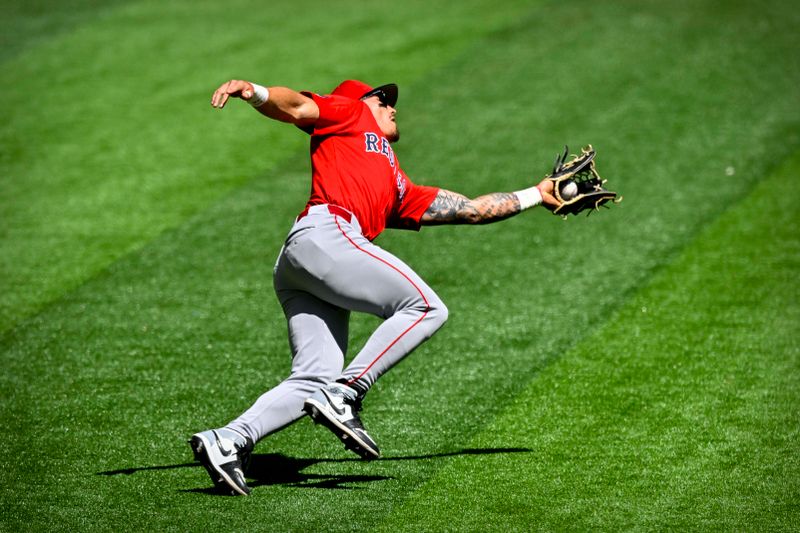 Mar 26, 2024; Arlington, Texas, USA; Boston Red Sox left fielder Jarren Duran (16) catches a fly ball hit by Texas Rangers shortstop Corey Seager (not pictured) during the first inning at Globe Life Field. Mandatory Credit: Jerome Miron-USA TODAY Sports