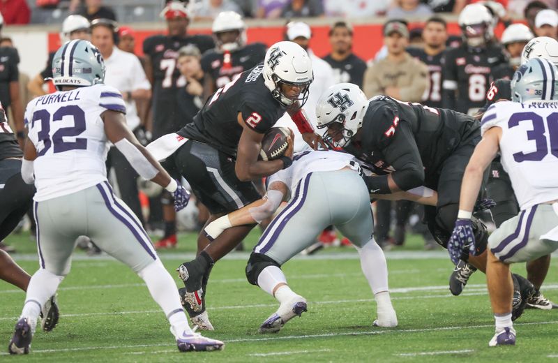 Nov 2, 2024; Houston, Texas, USA; Houston Cougars quarterback Zeon Chriss (2) runs the ball against the Kansas State Wildcats in the first quarter at TDECU Stadium. Mandatory Credit: Thomas B. Shea-Imagn Images