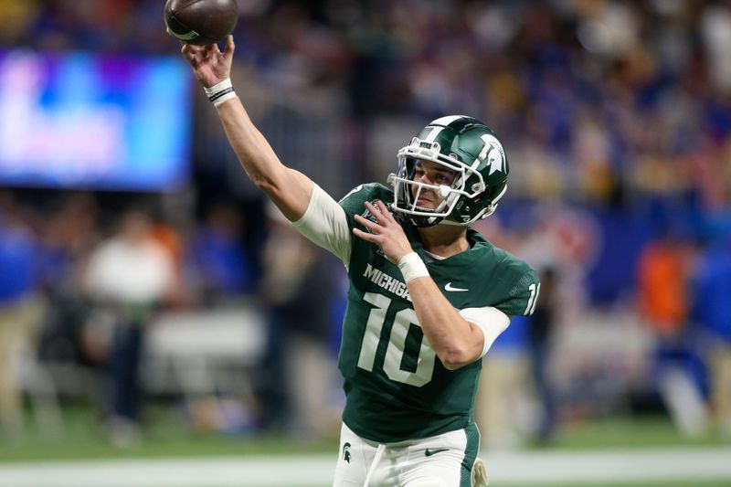 Dec 30, 2021; Atlanta, GA, USA; Michigan State Spartans quarterback Payton Thorne (10) throws before the 2021 Peach Bowl against the Pittsburgh Panthers at Mercedes-Benz Stadium. Mandatory Credit: Brett Davis-USA TODAY Sports