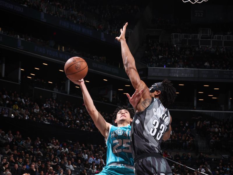 BROOKLYN, NY - FEBRUARY 10:  KJ Simpson #25 of the Charlotte Hornets drives to the basket during the game against the Brooklyn Nets on February 10, 2025 at Barclays Center in Brooklyn, New York. NOTE TO USER: User expressly acknowledges and agrees that, by downloading and or using this Photograph, user is consenting to the terms and conditions of the Getty Images License Agreement. Mandatory Copyright Notice: Copyright 2025 NBAE (Photo by Nathaniel S. Butler/NBAE via Getty Images)